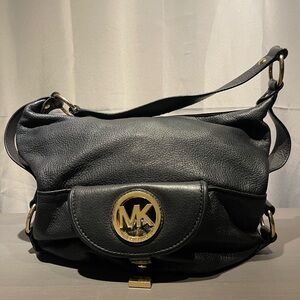 Michael Kors Black Shoulder Bag with Gold Emblem.
